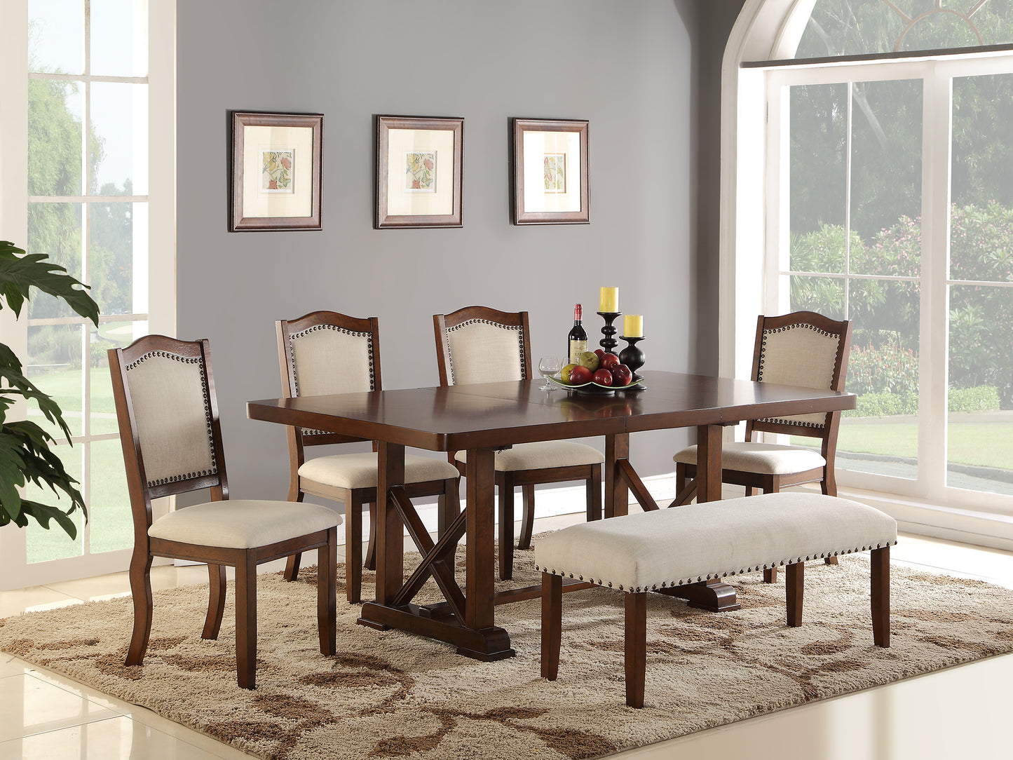 Dark wood dining table set with upholstered chairs and bench