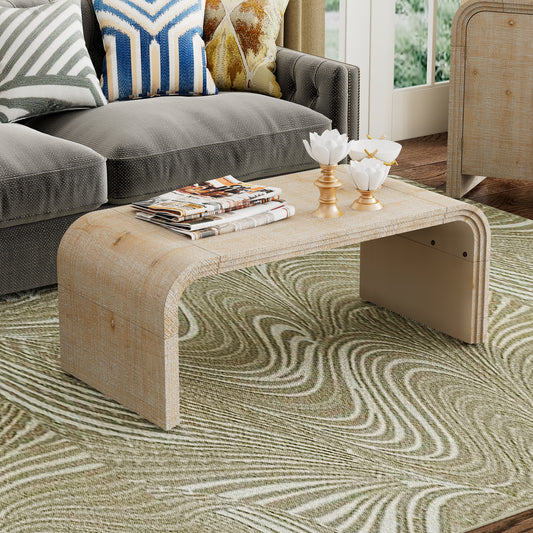 Waterfall coffee table in light wood finish with textured surface