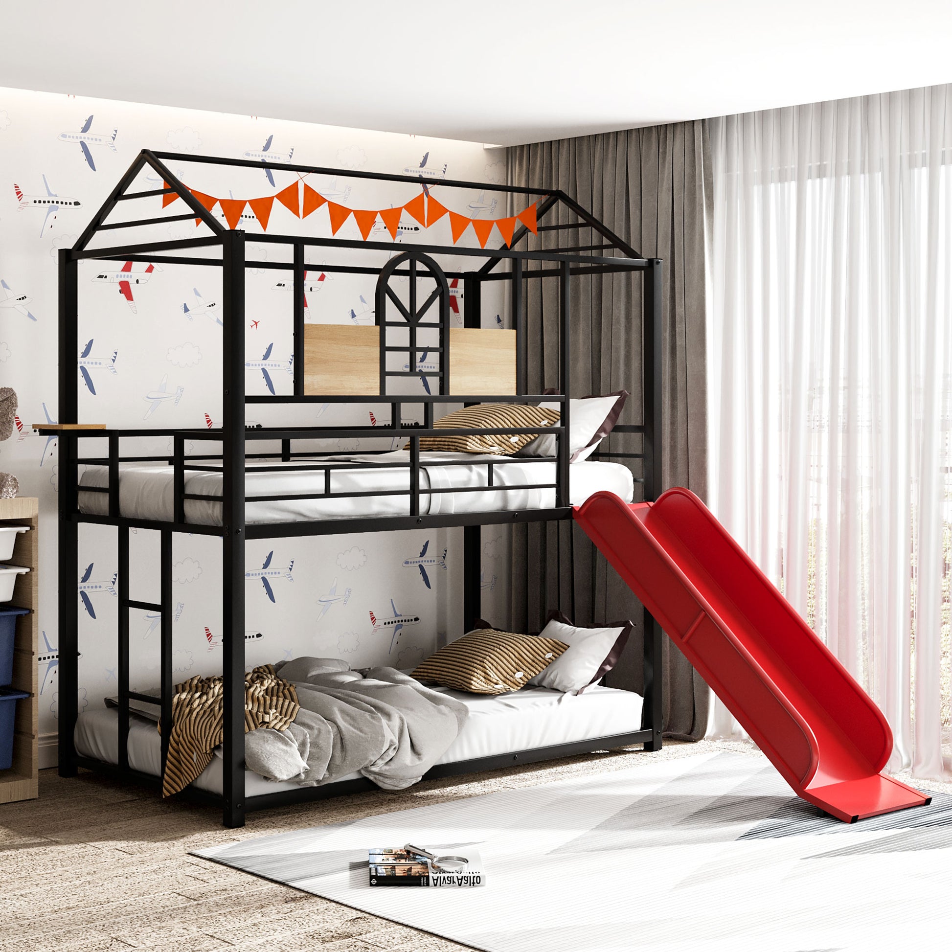 Black metal twin over twin bunk bed with red slide and airplane wallpaper