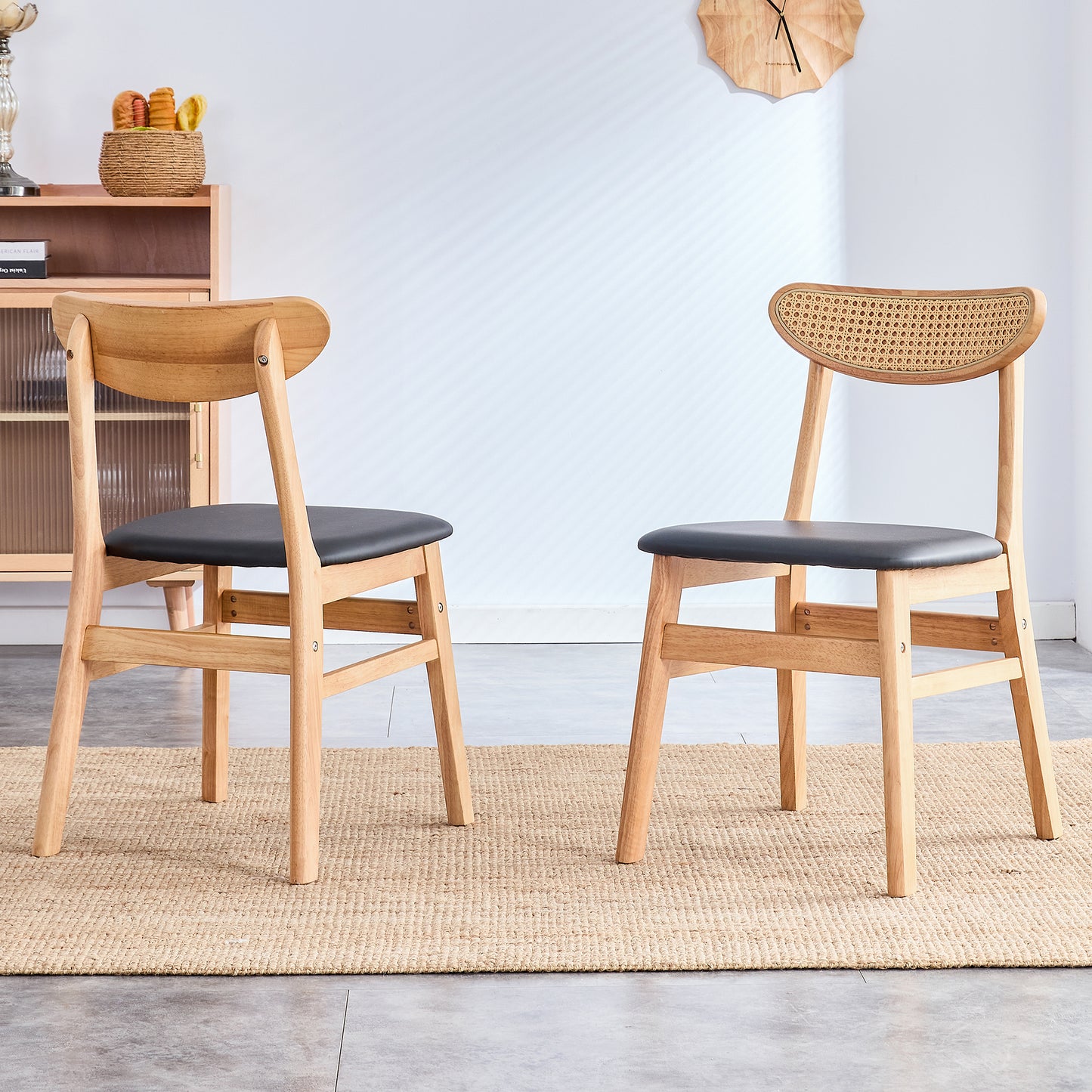 Natural wood dining chair with black faux leather seat and cane back