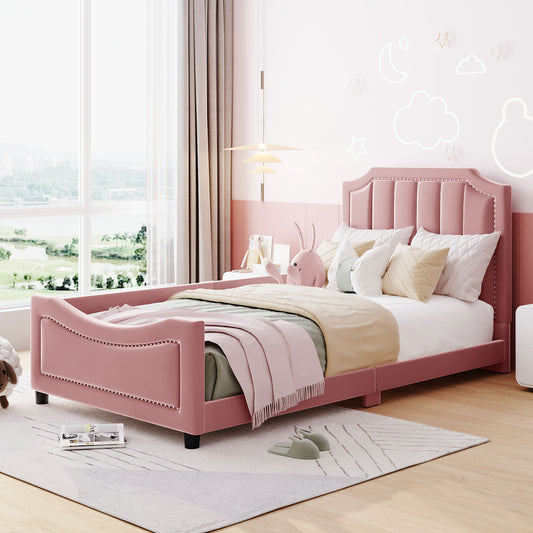 Pink velvet upholstered twin bed with nailhead trim and storage drawers