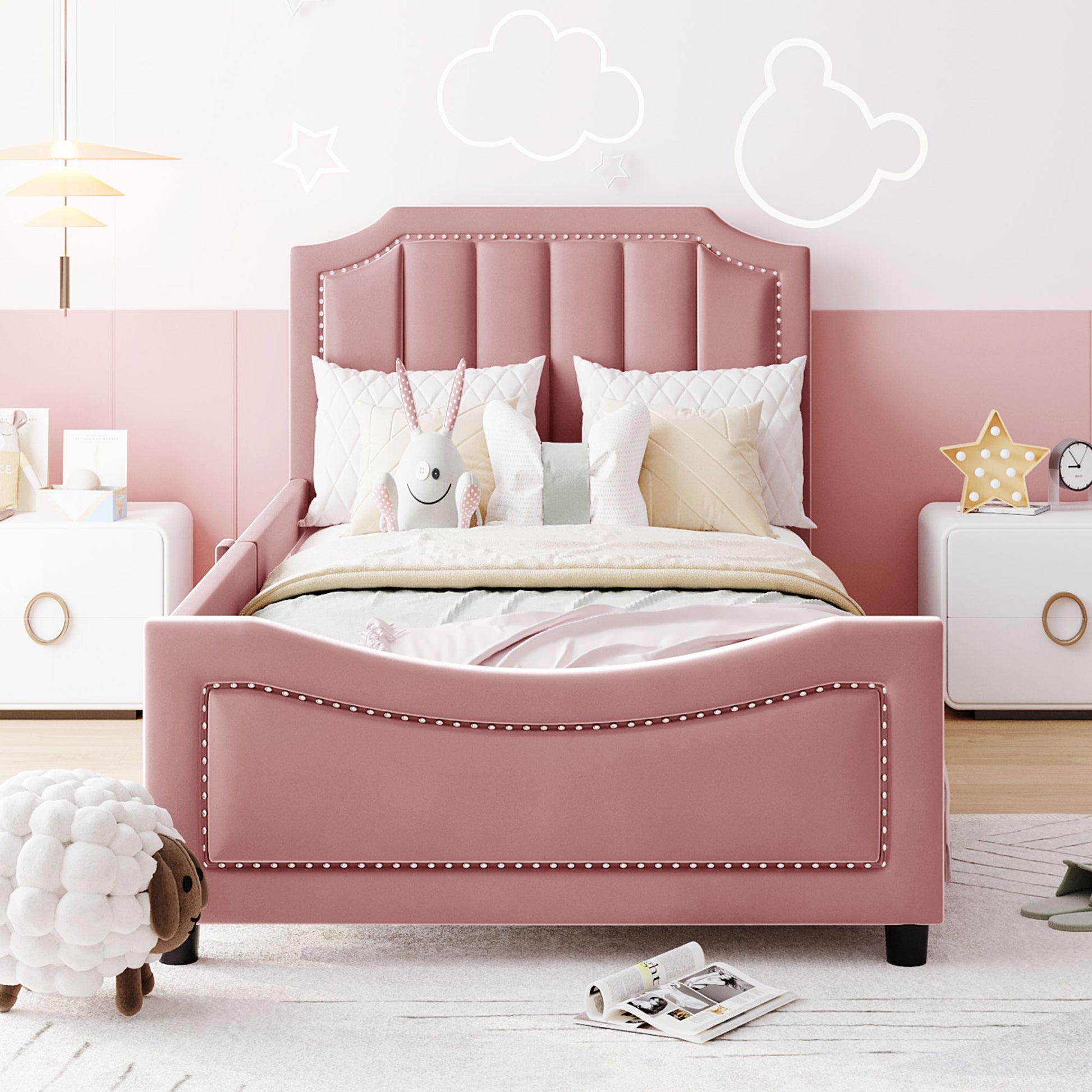 Pink velvet twin bed with tufted headboard and nailhead trim