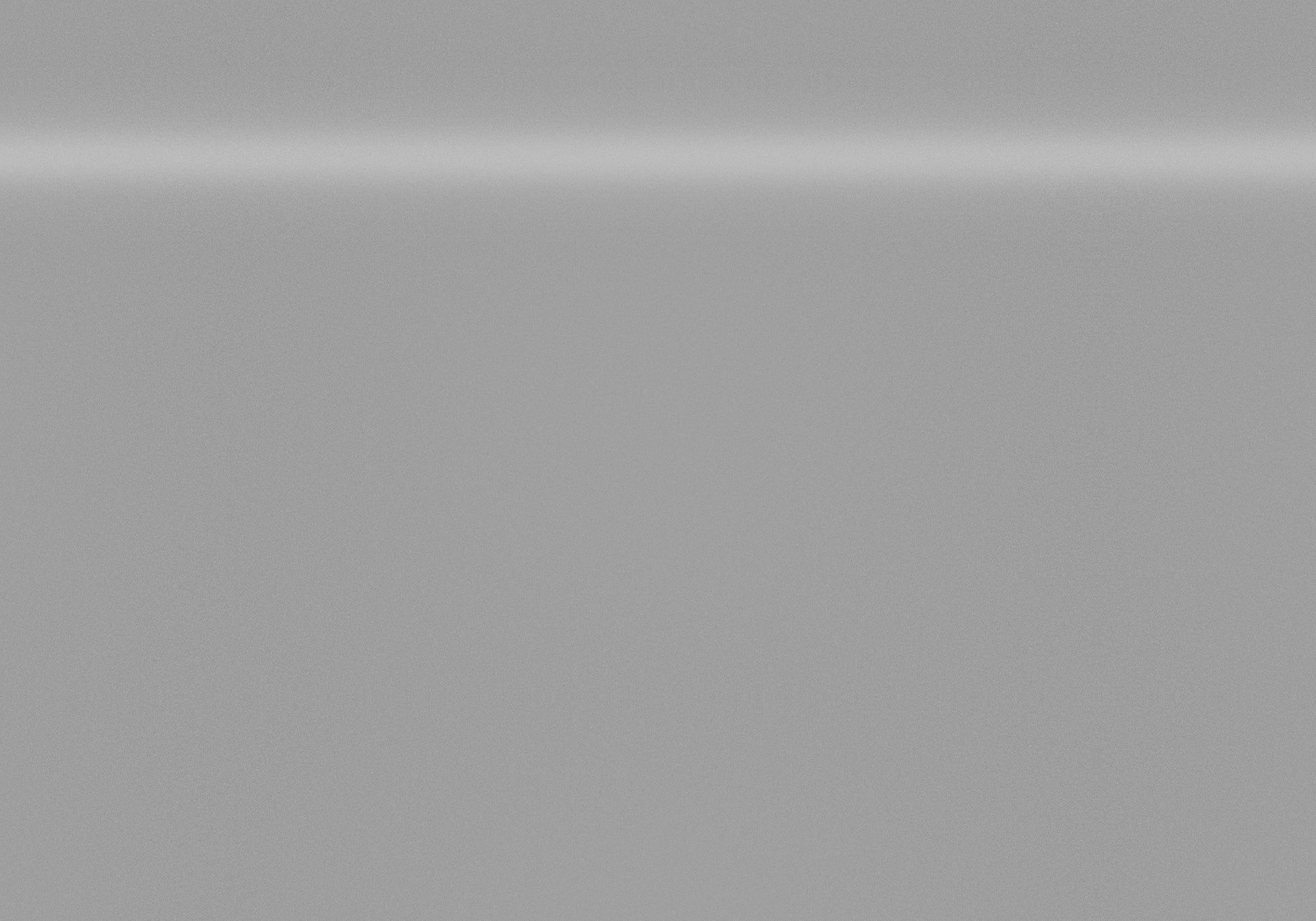 Brushed stainless steel refrigerator door with subtle horizontal reflection