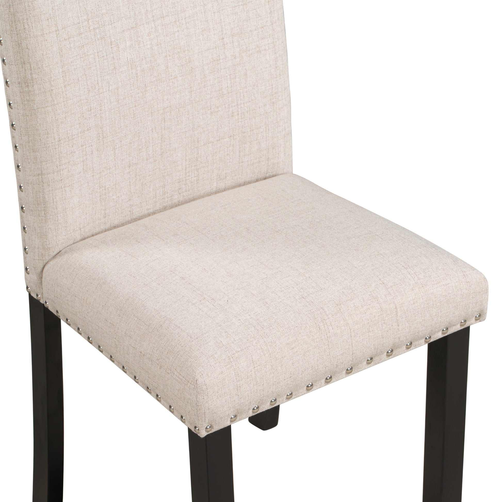 Beige linen dining chair with nailhead trim and dark wood legs