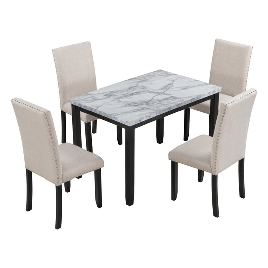 Marble top dining table with four beige upholstered chairs