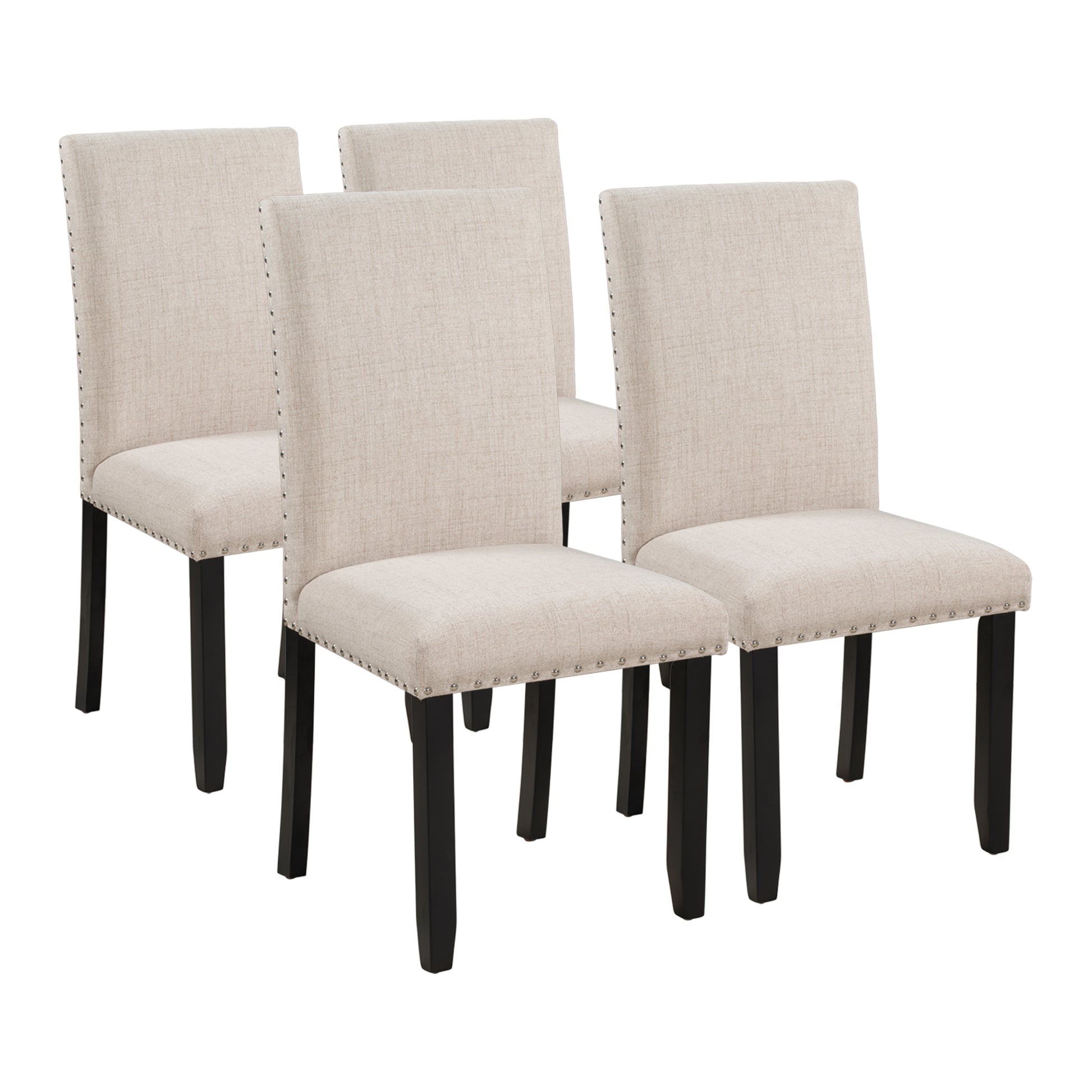 Set of four beige upholstered dining chairs with black legs and silver nailhead trim