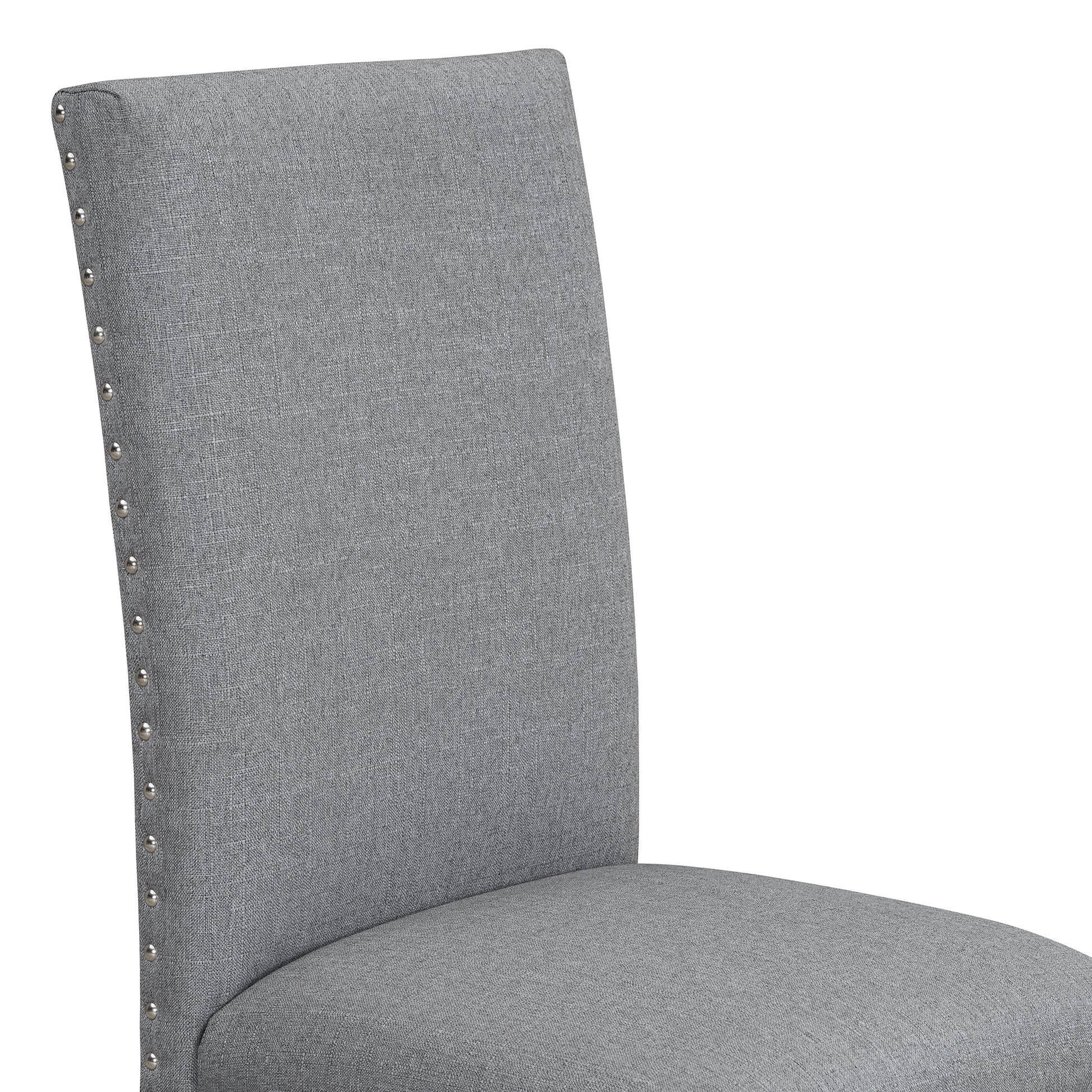 Gray linen dining chair with nailhead trim on the backrest