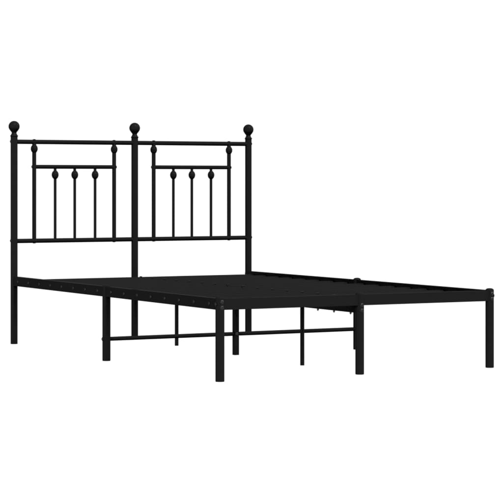Black metal platform bed frame with ornate headboard