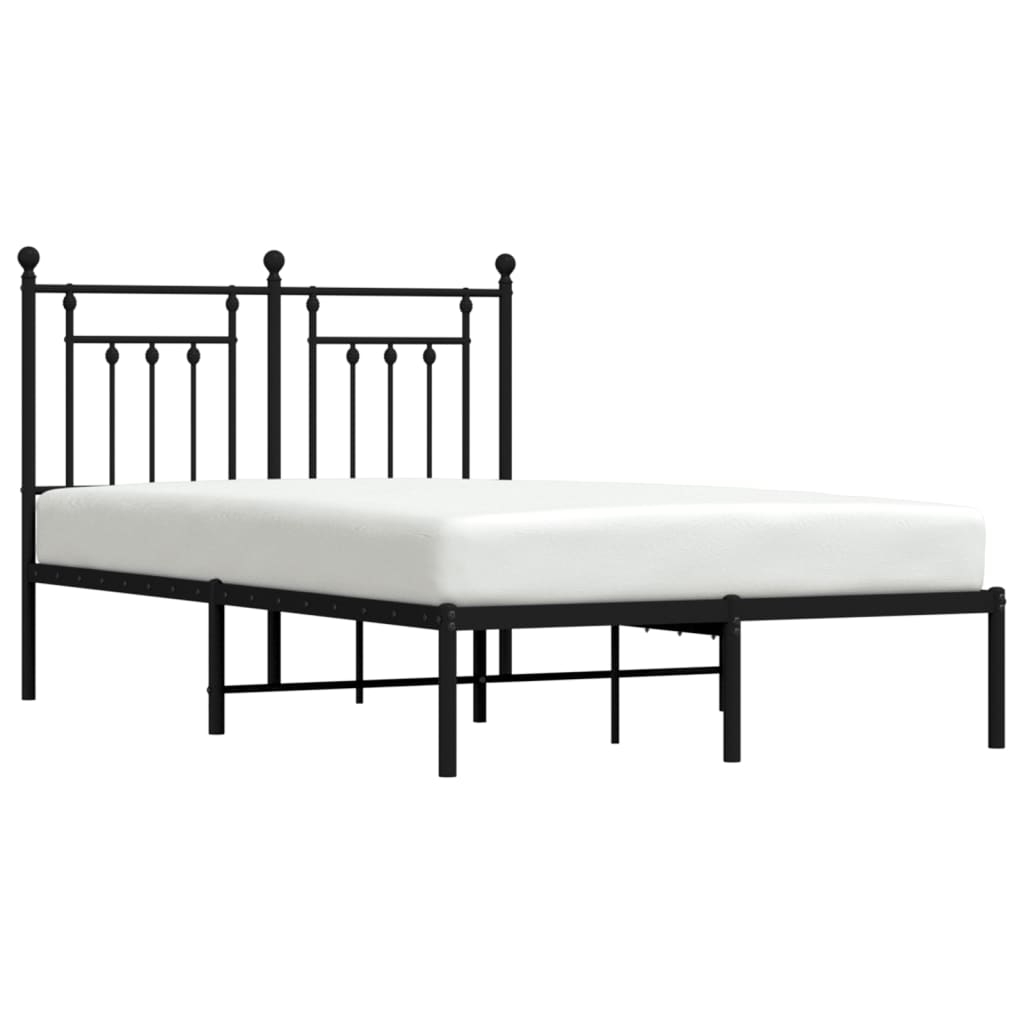 Bronze metal bed frame with ornate headboard and footboard