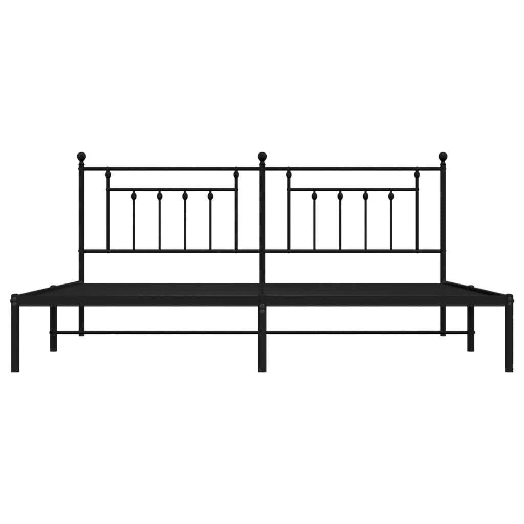 Black metal bed frame with ornate headboard and mattress support