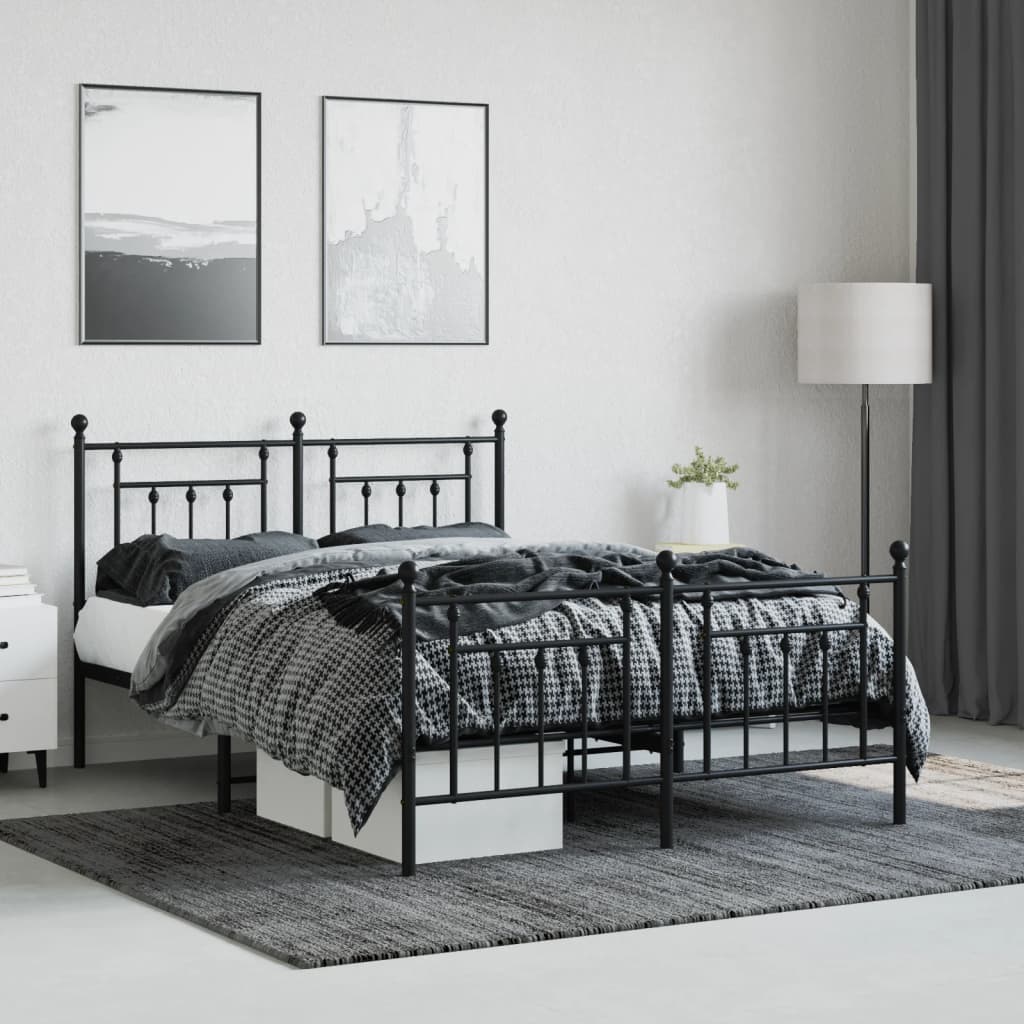 Black metal twin bed frame with decorative finials and slatted base