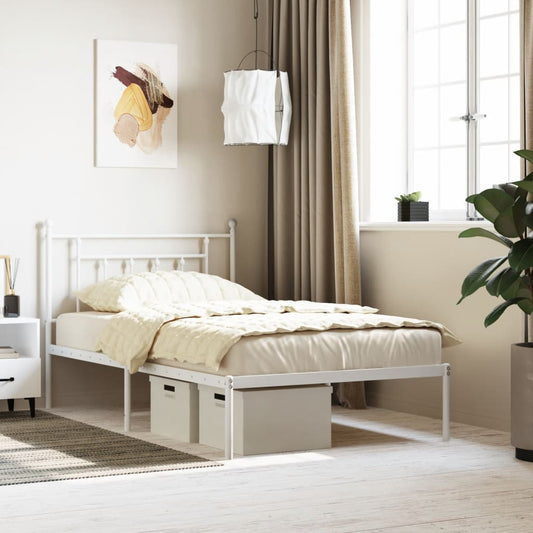 White metal twin bed frame with ornate headboard and footboard