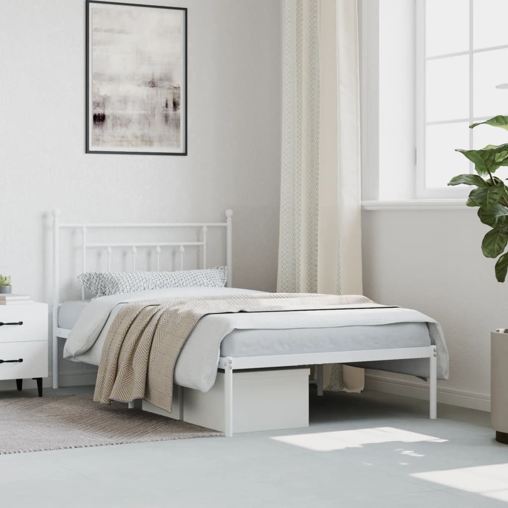White metal bed frame with a classic headboard design