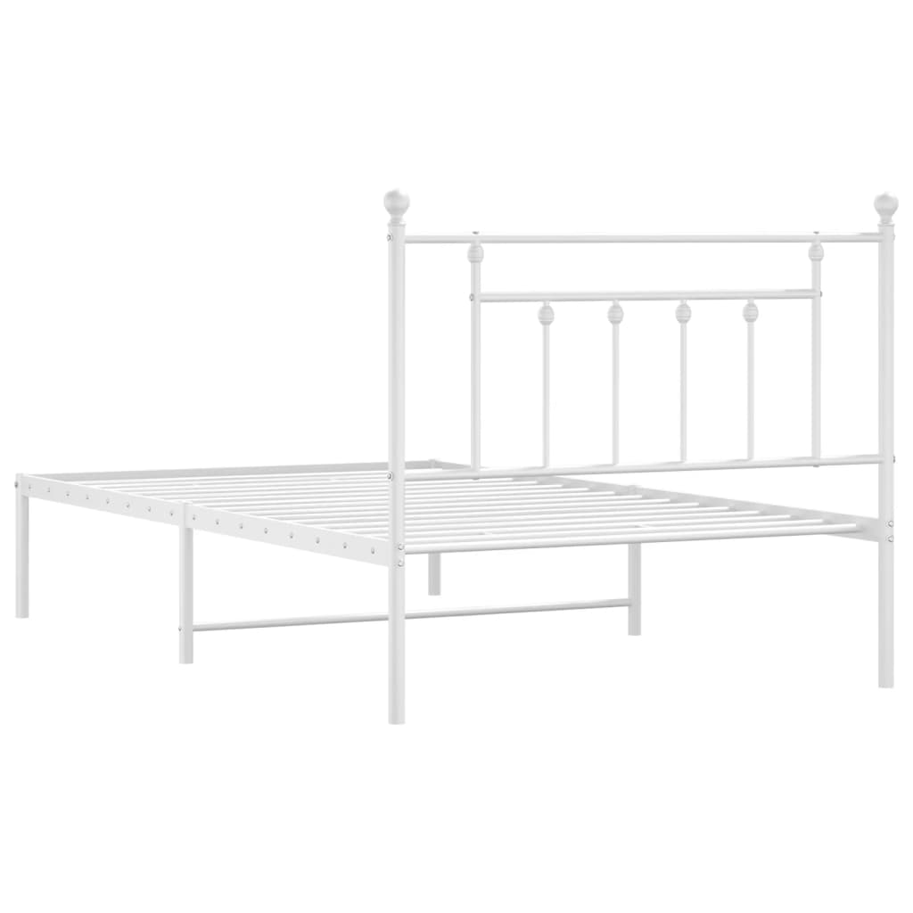 White metal twin bed frame with ornate headboard detail