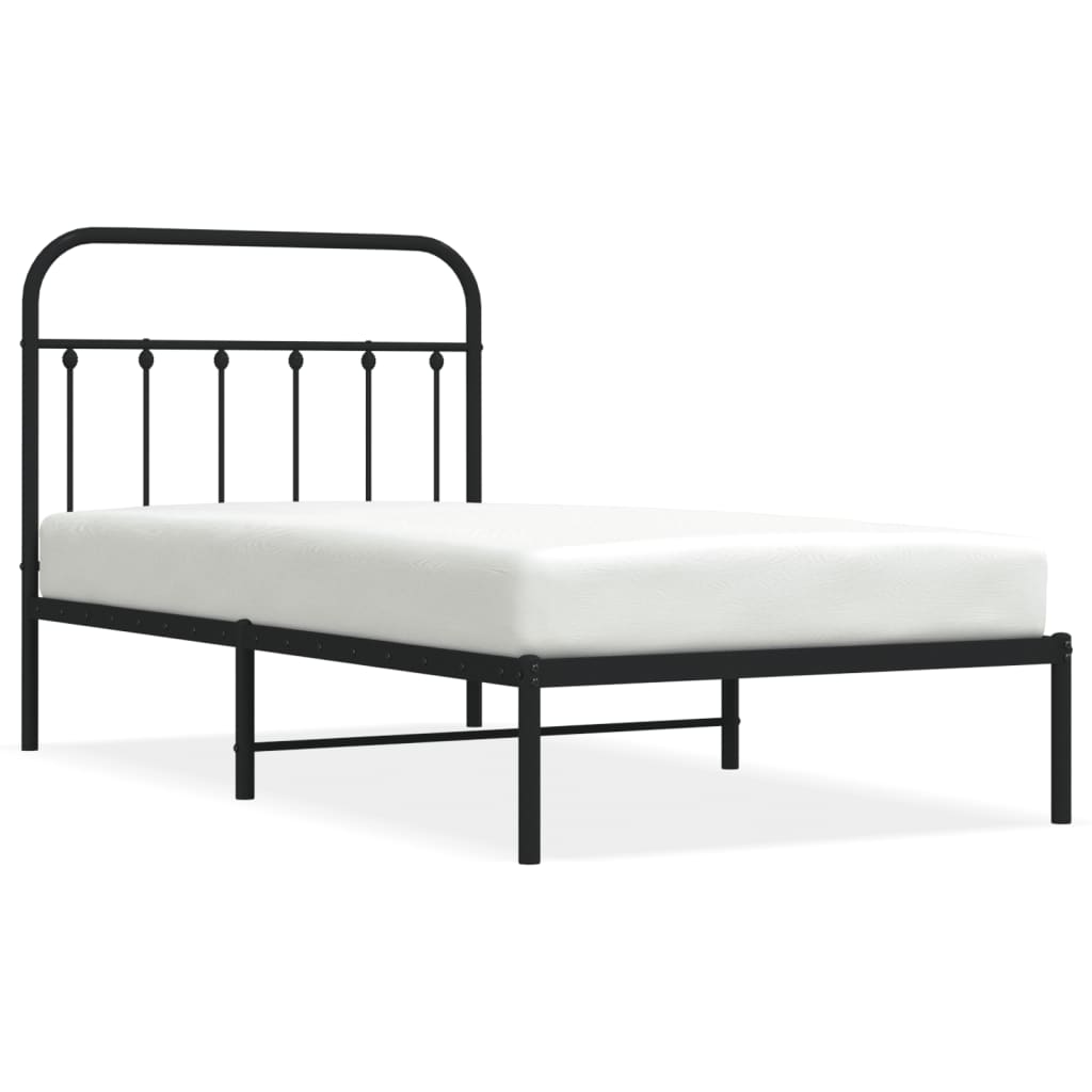 White metal bed frame with a decorative headboard and slatted base