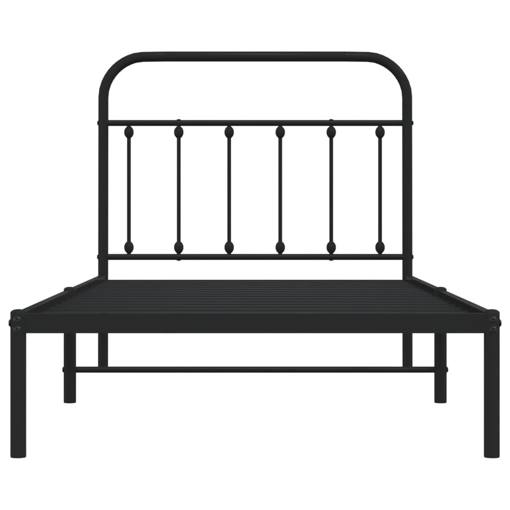 Black metal bed frame with a white mattress and curved headboard