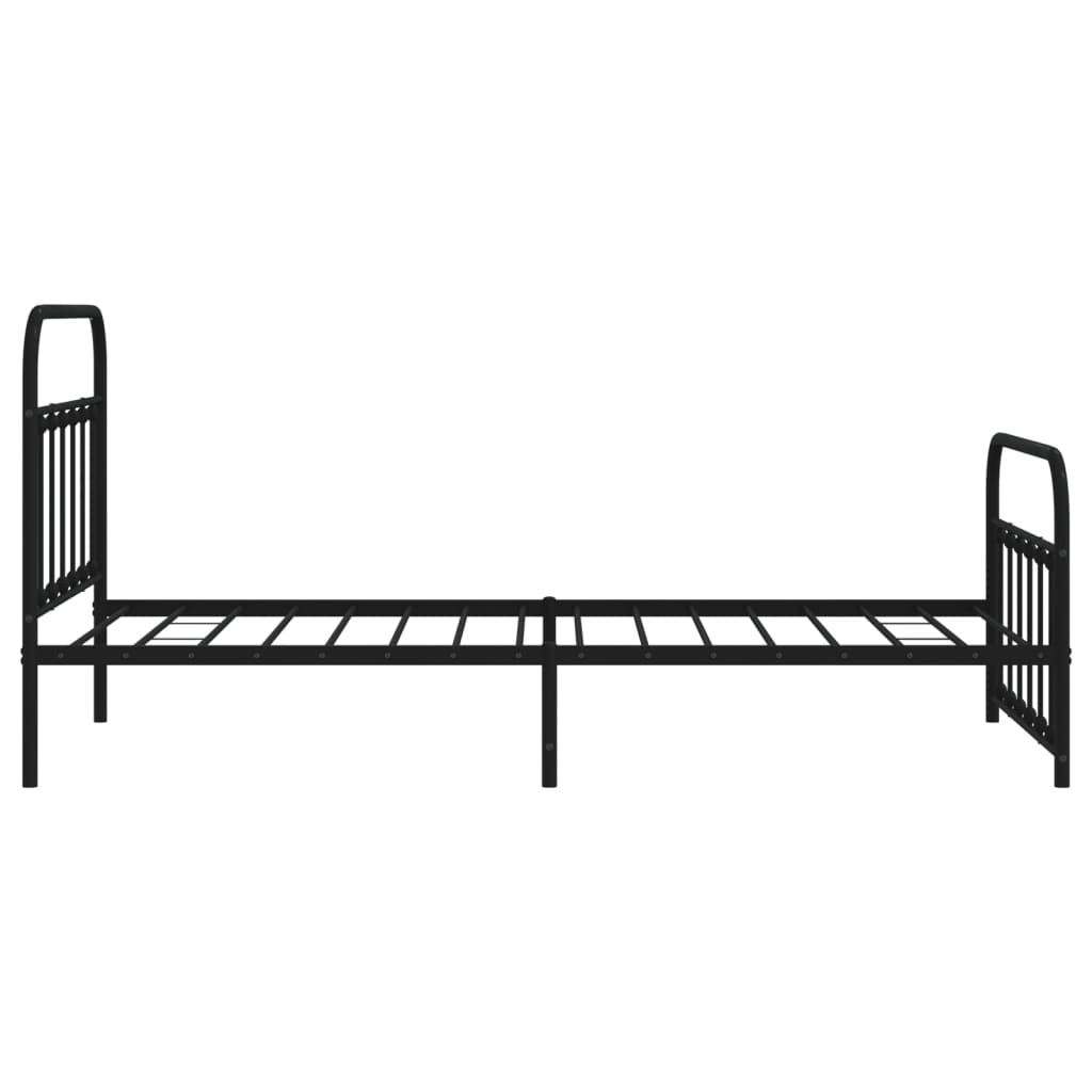Black metal daybed with ornate finials and a slatted mattress support