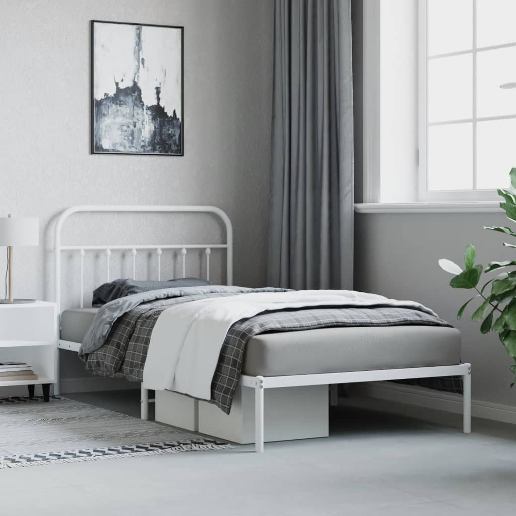 Classic white metal twin bed frame with a curved headboard and footboard