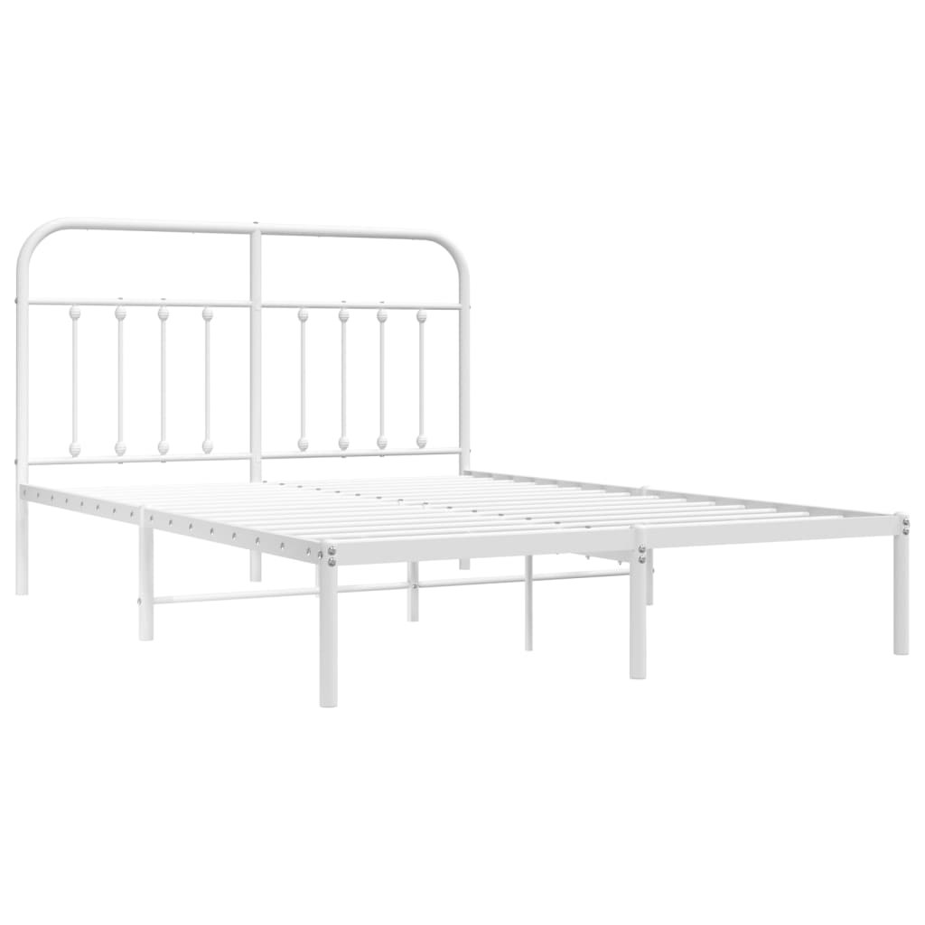 White metal bed frame with a classic headboard design and mattress