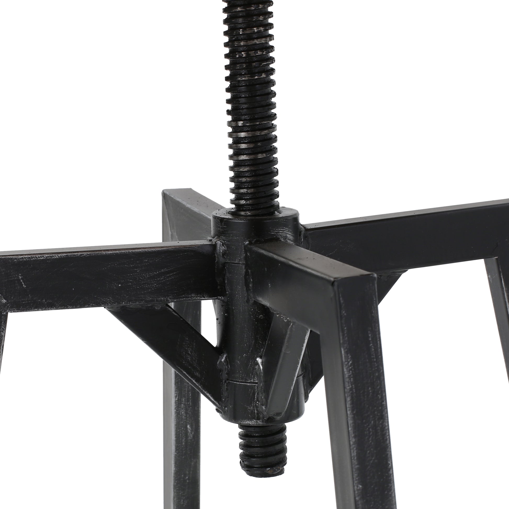 Closeup of a black metal screw mechanism on an adjustable stool base