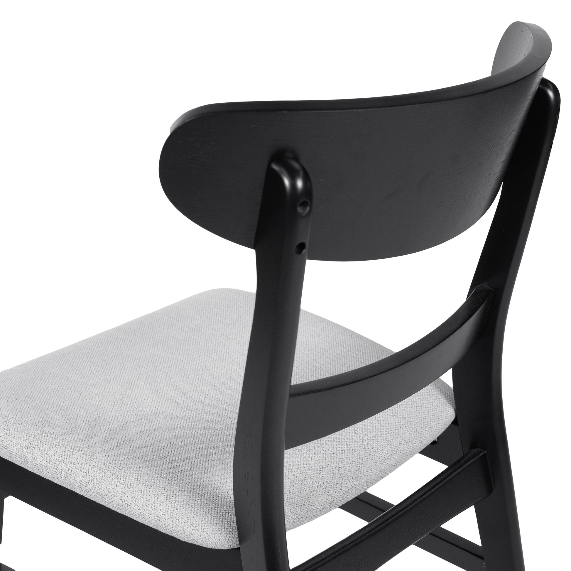 Black modern wooden dining chair with light grey upholstered seat