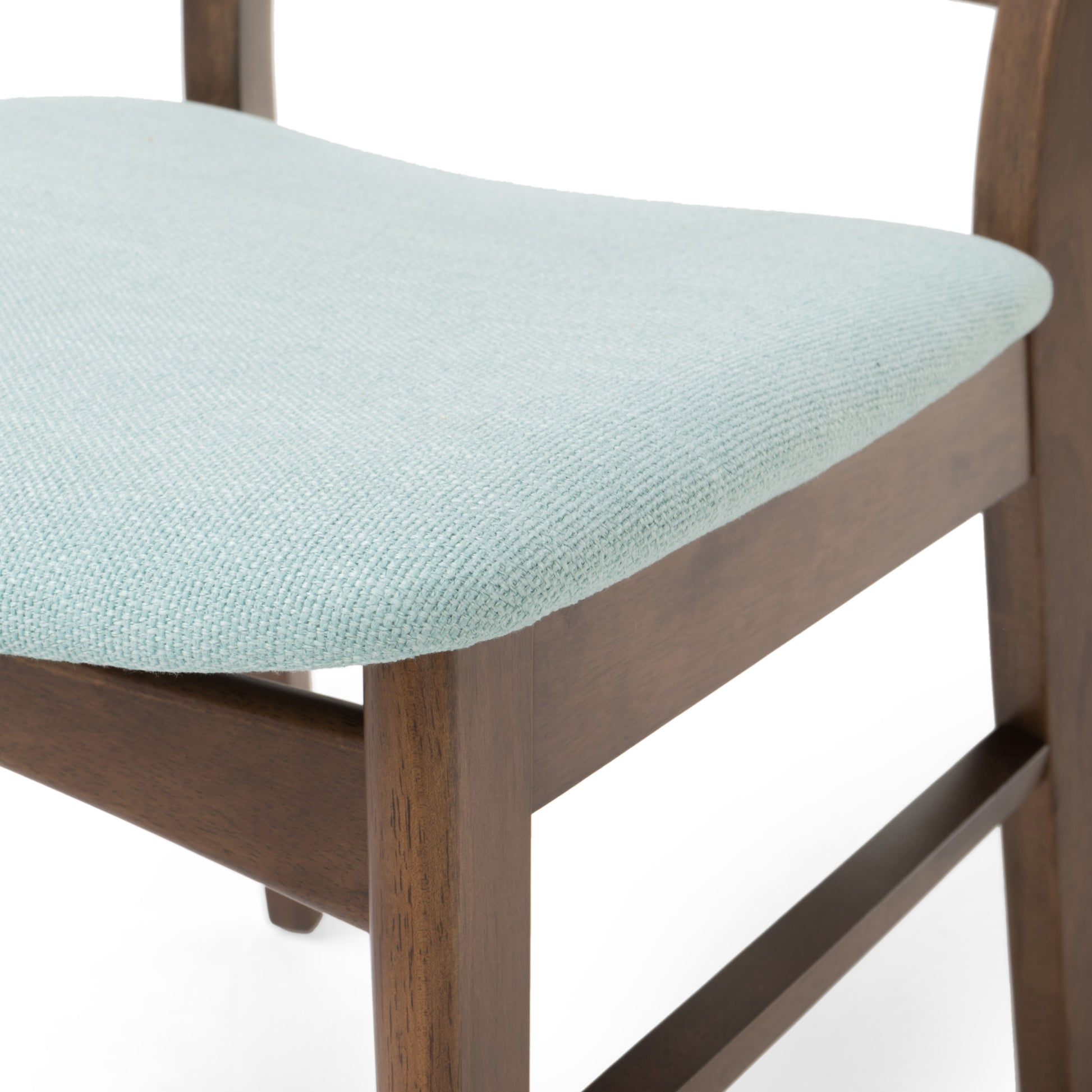 Closeup of a light blue fabric seat cushion on a dark wood dining chair