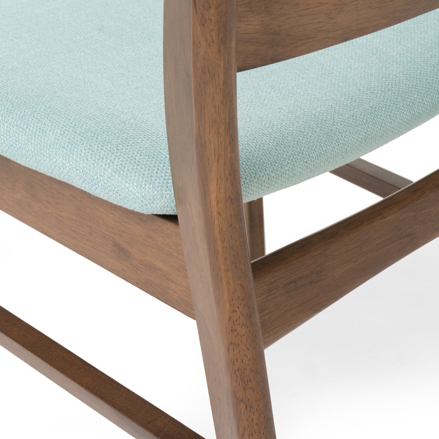 Closeup of a light blue textured fabric seat on a midcentury modern wooden chair