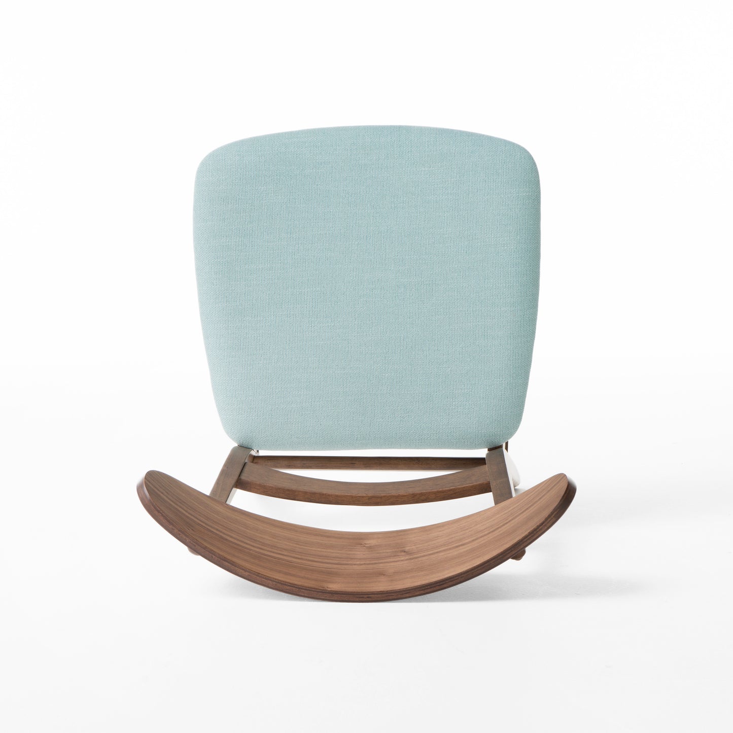 Light blue upholstered rocking chair with curved walnut wood base