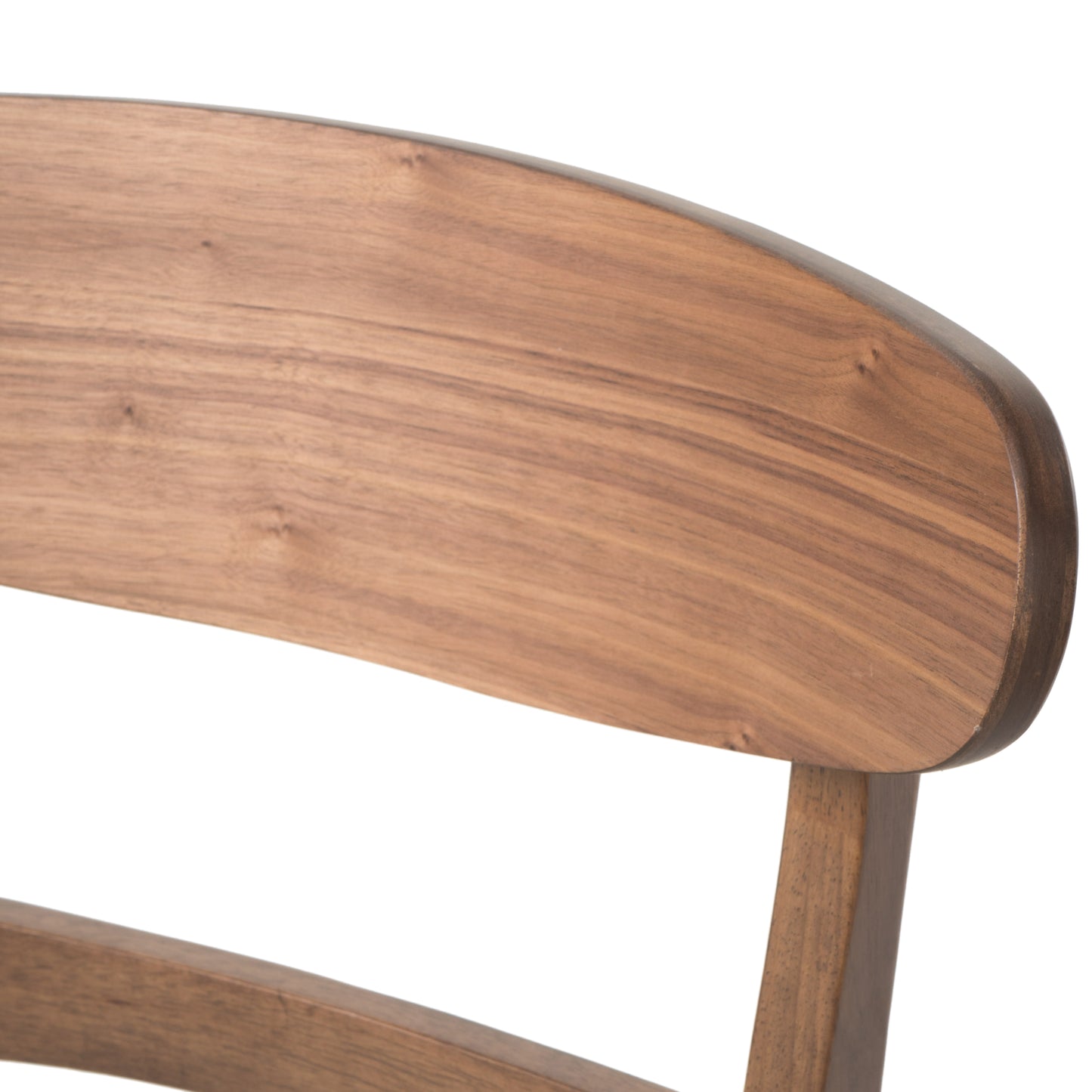Closeup of curved walnut wood chair back with natural grain patterns