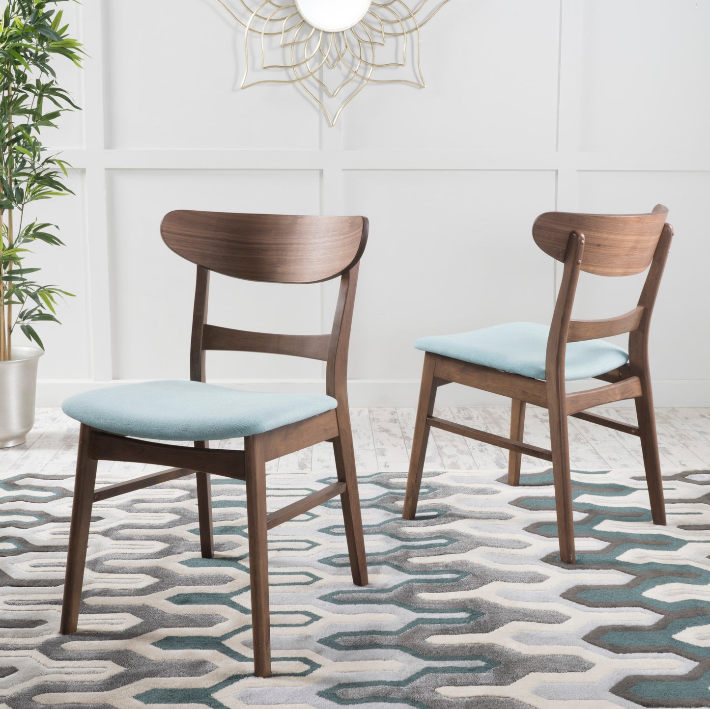 Midcentury modern walnut dining chair with light blue upholstered seat
