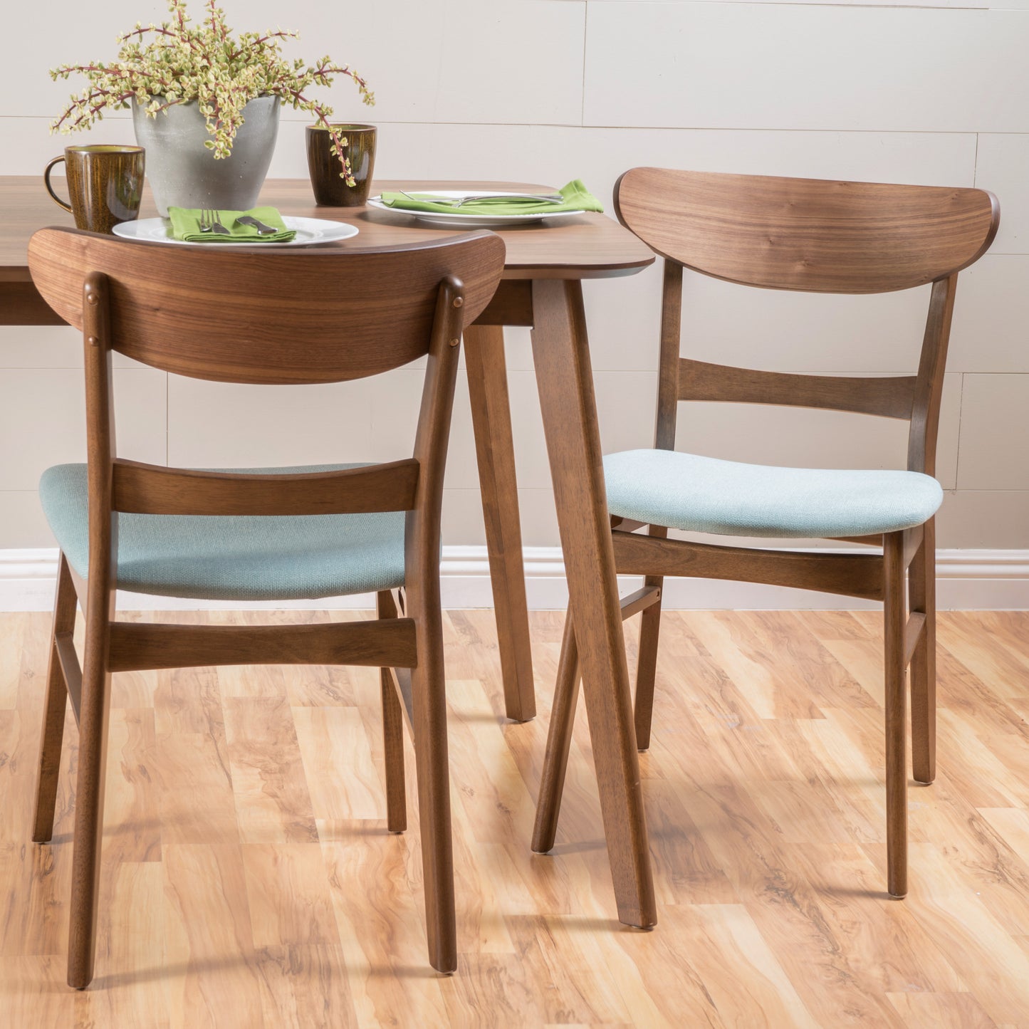Midcentury modern walnut dining chair with light blue upholstered seat