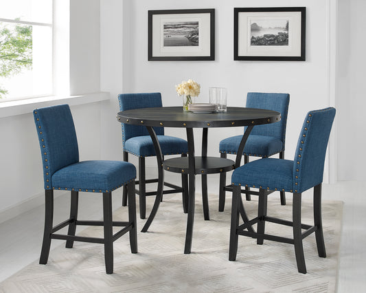Round dark wood counter height table with riveted edge and four blue upholstered bar stools