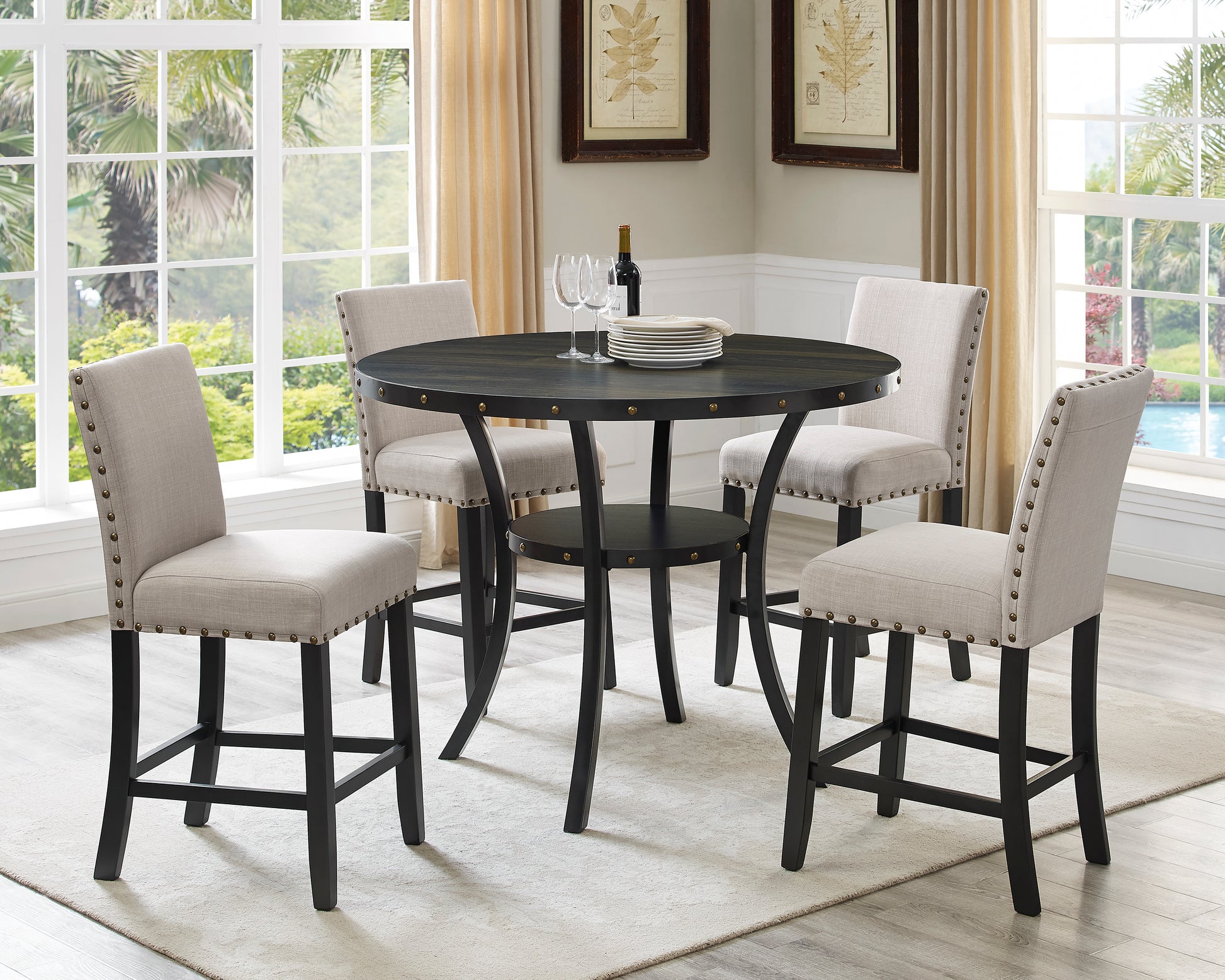 Dark wood round dining table with four upholstered counter stools
