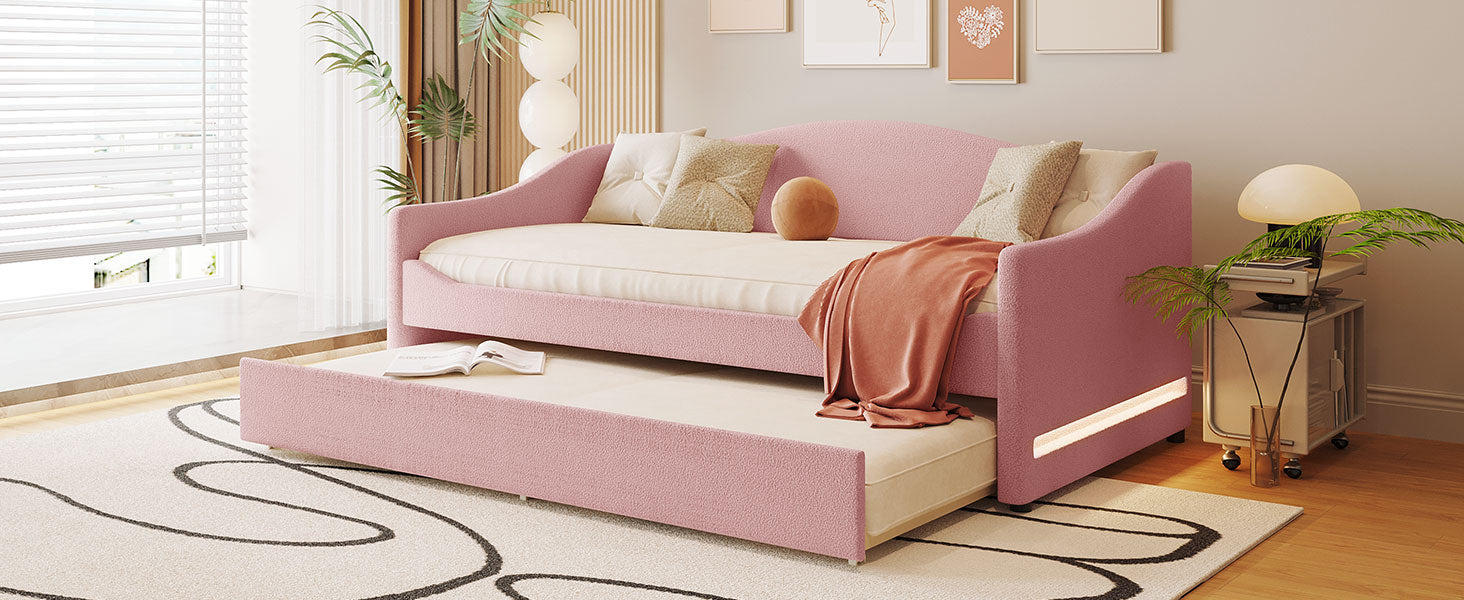 Pink upholstered daybed with pullout trundle