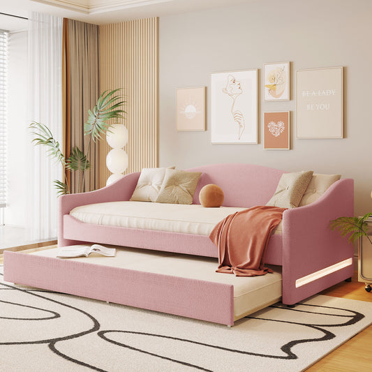Pink upholstered daybed with pullout trundle