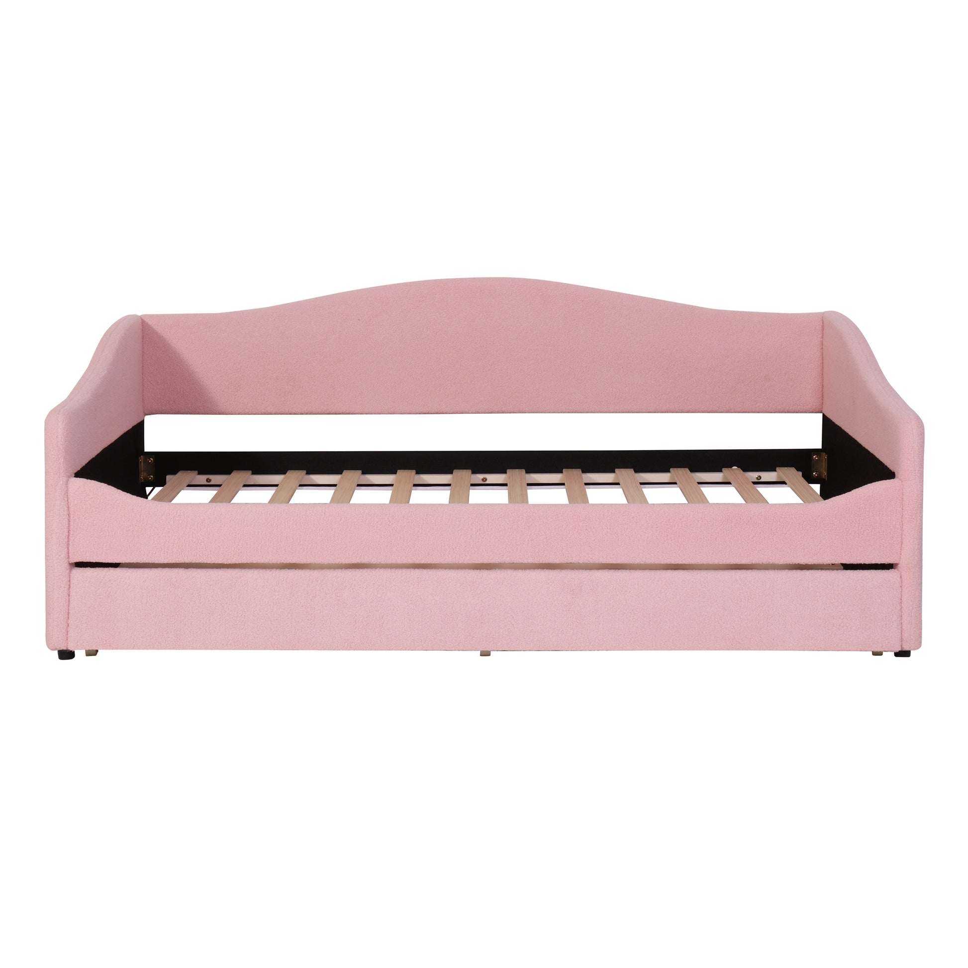Pink upholstered daybed with arched back and wooden slats