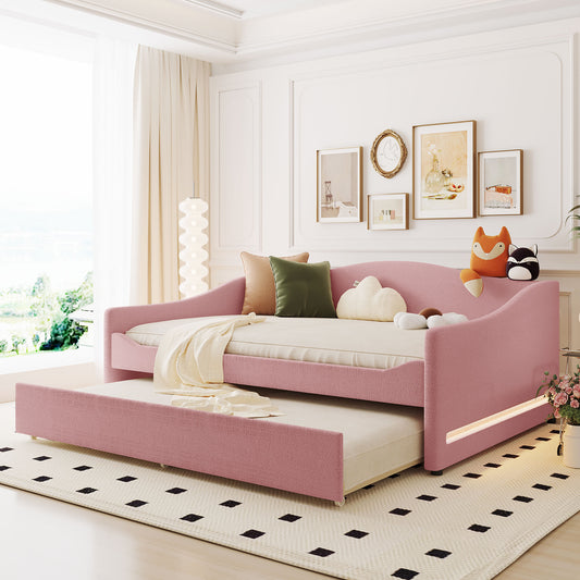 Pink upholstered daybed with pullout trundle