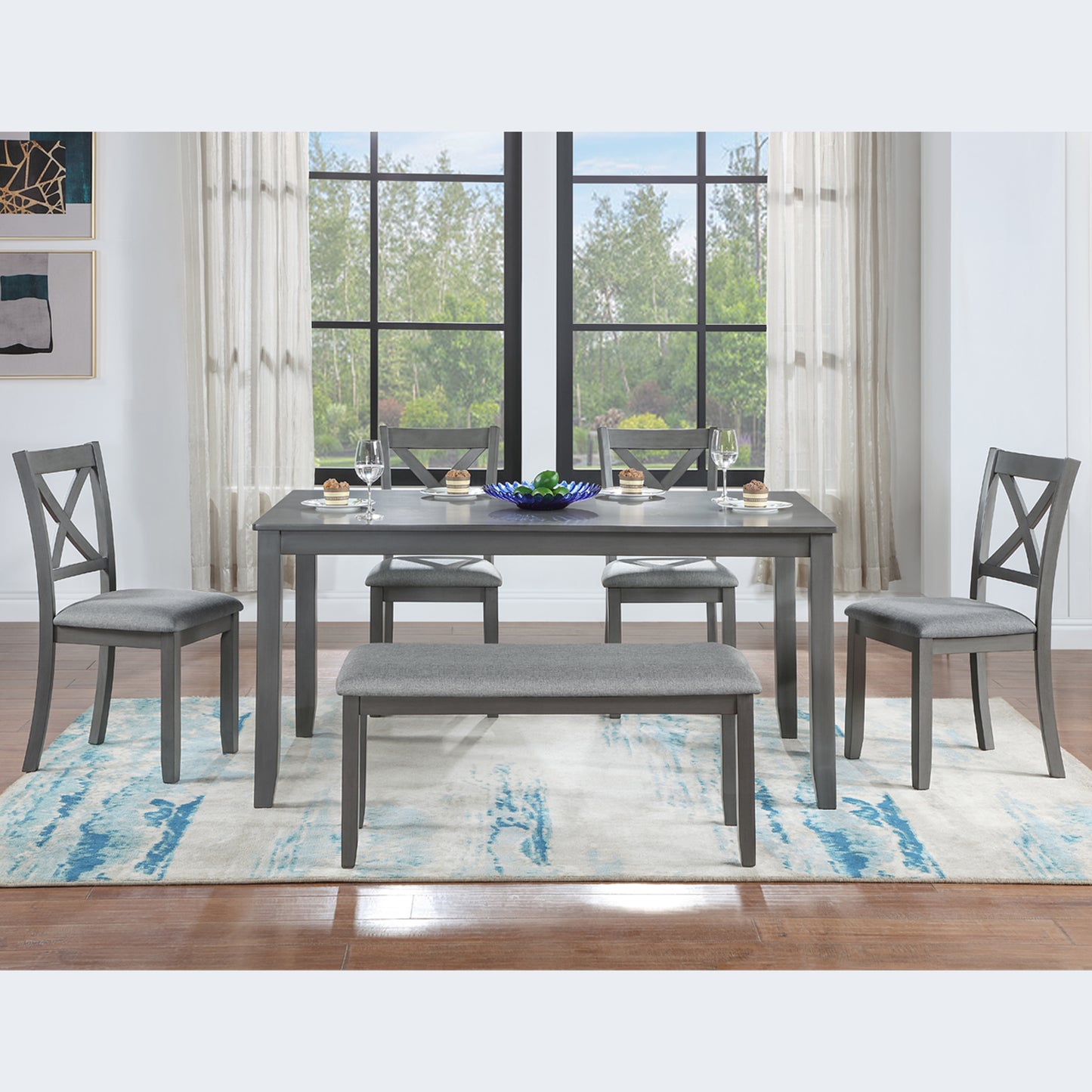 Gray upholstered dining set with Xback chairs and bench