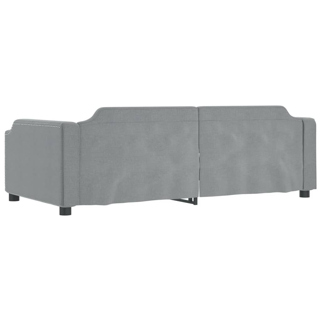 Grey upholstered accent chair with silver nailhead trim