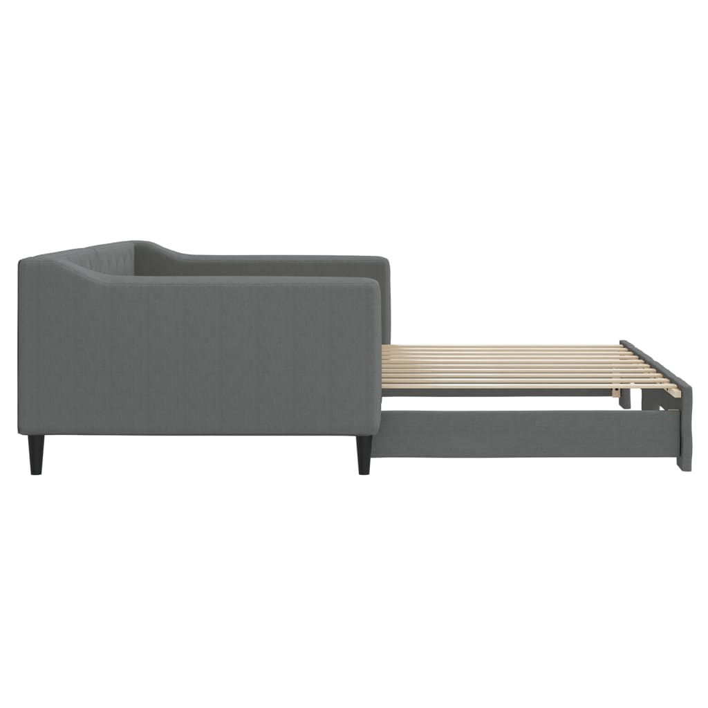 Grey upholstered daybed with tufted back and wooden slats