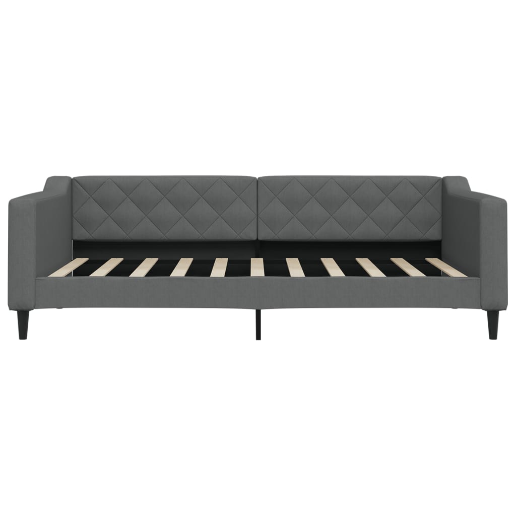 Tufted grey fabric daybed with a wooden slat base and black tapered legs