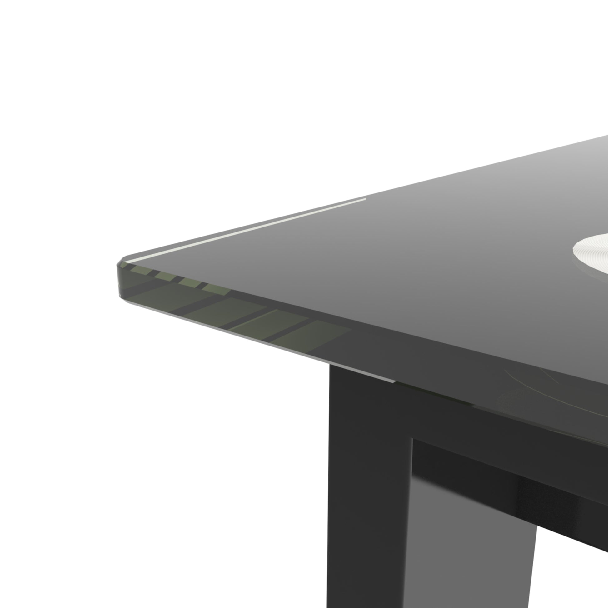 Sleek black glass coffee table with beveled edge detail