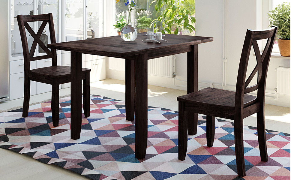 Dark wood dining chairs with Xback design and matching table on geometric rug