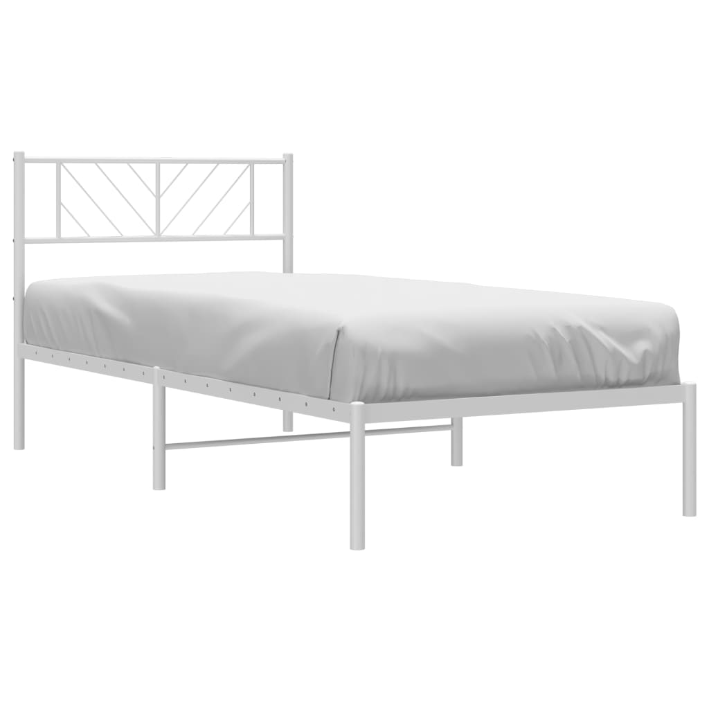 White metal twin bed frame with geometric headboard and mattress