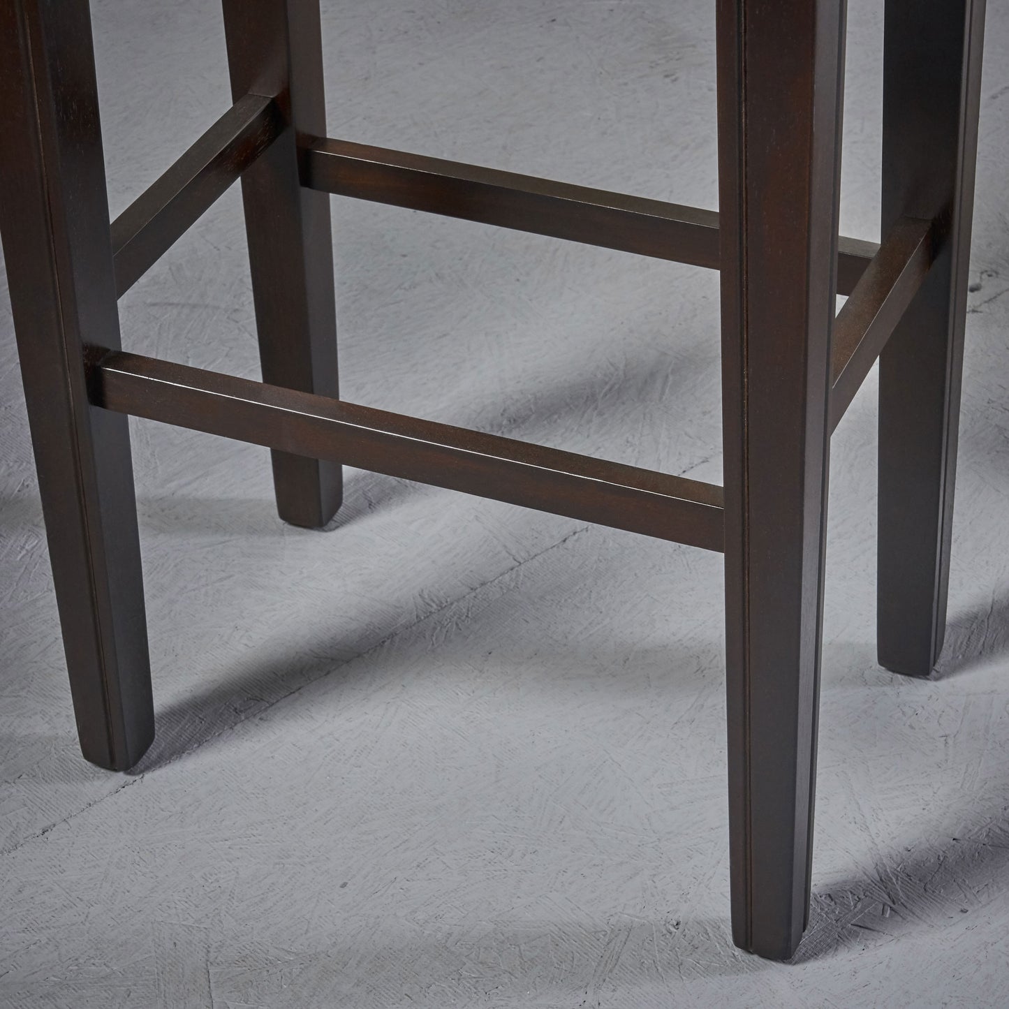 Dark brown wooden bar stool legs with cross supports