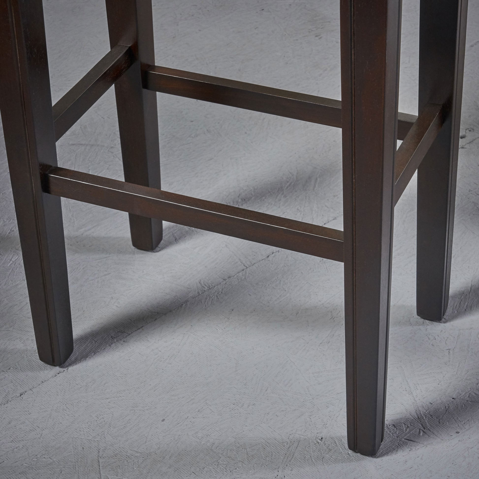 Dark brown wooden bar stool legs with cross supports