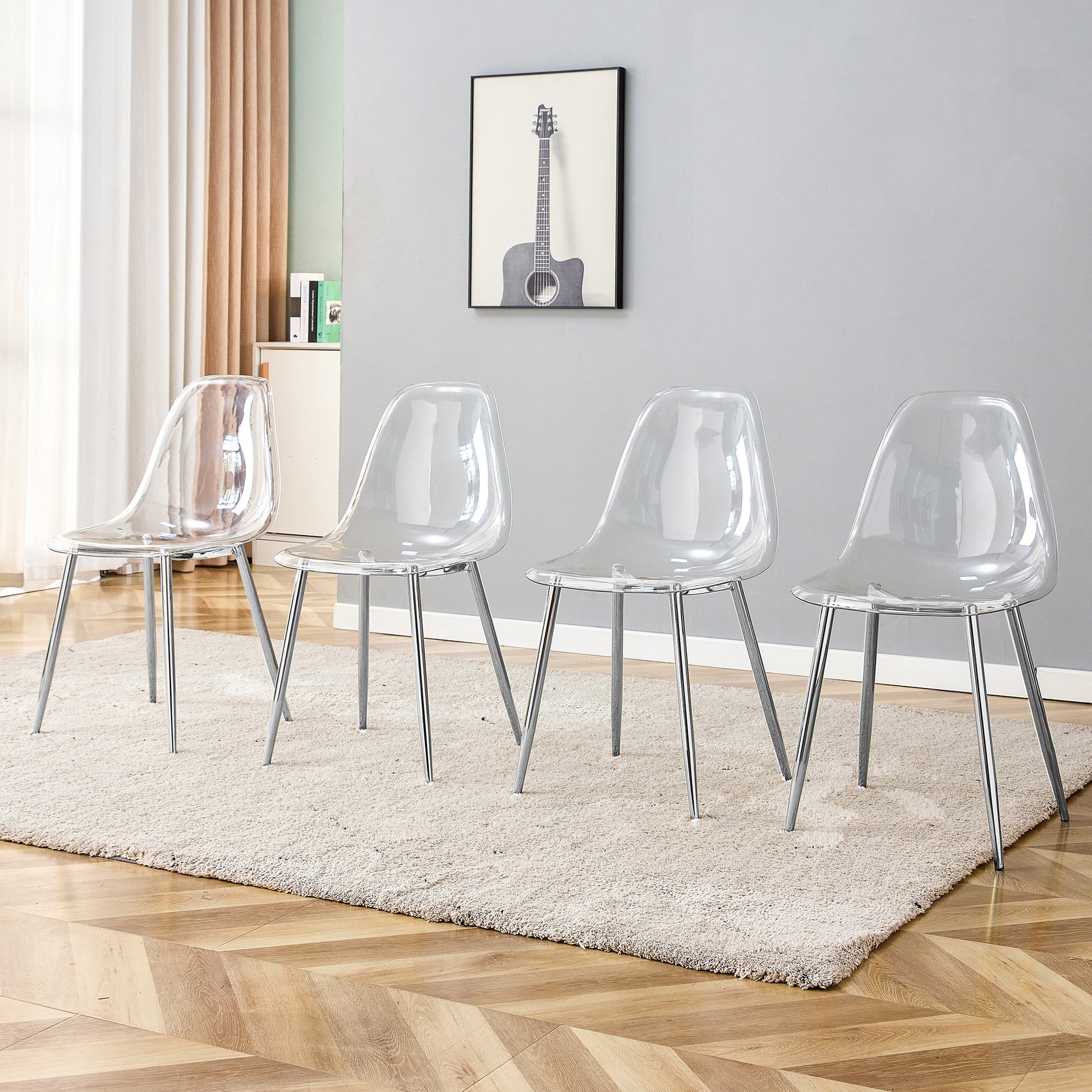 Four clear acrylic chairs with chrome legs on a textured rug
