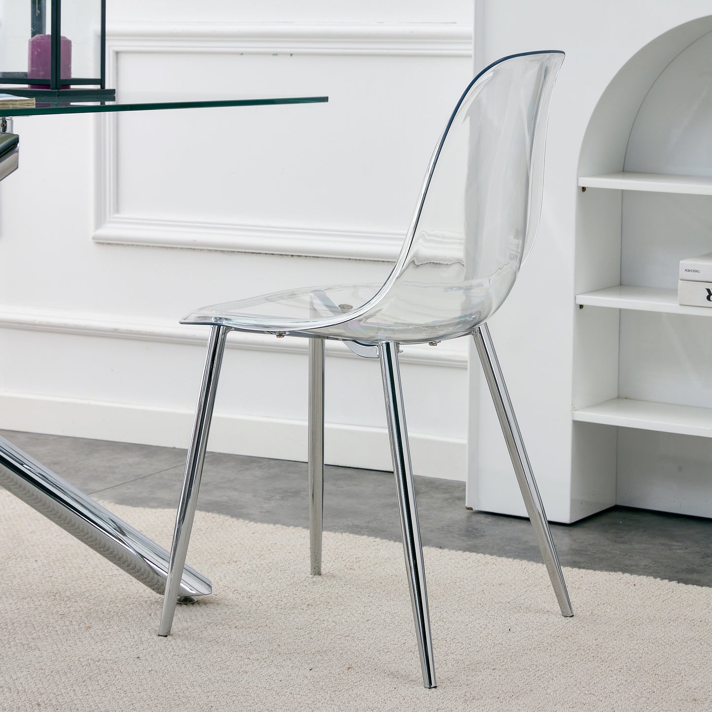 Clear acrylic dining chair with polished chrome legs