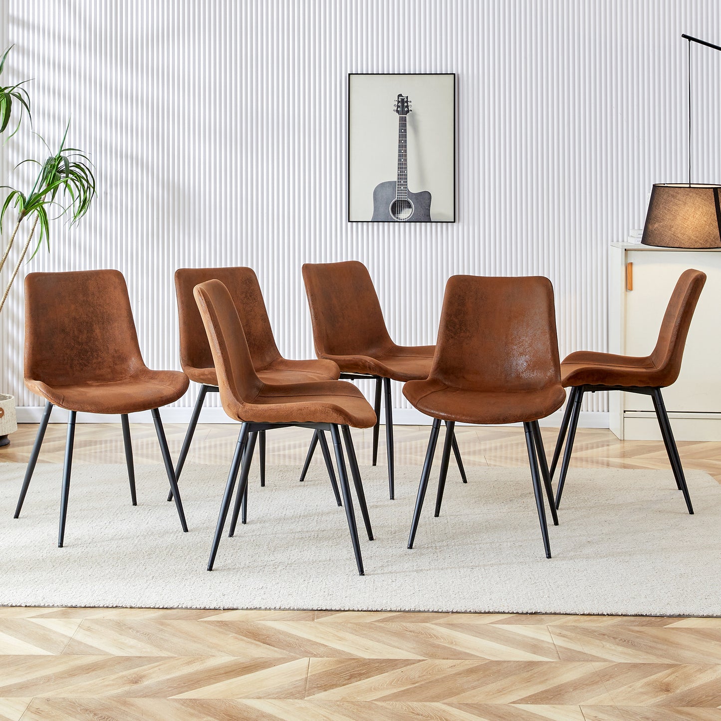 Set of  rustic brown faux leather dining chairs with black metal legs