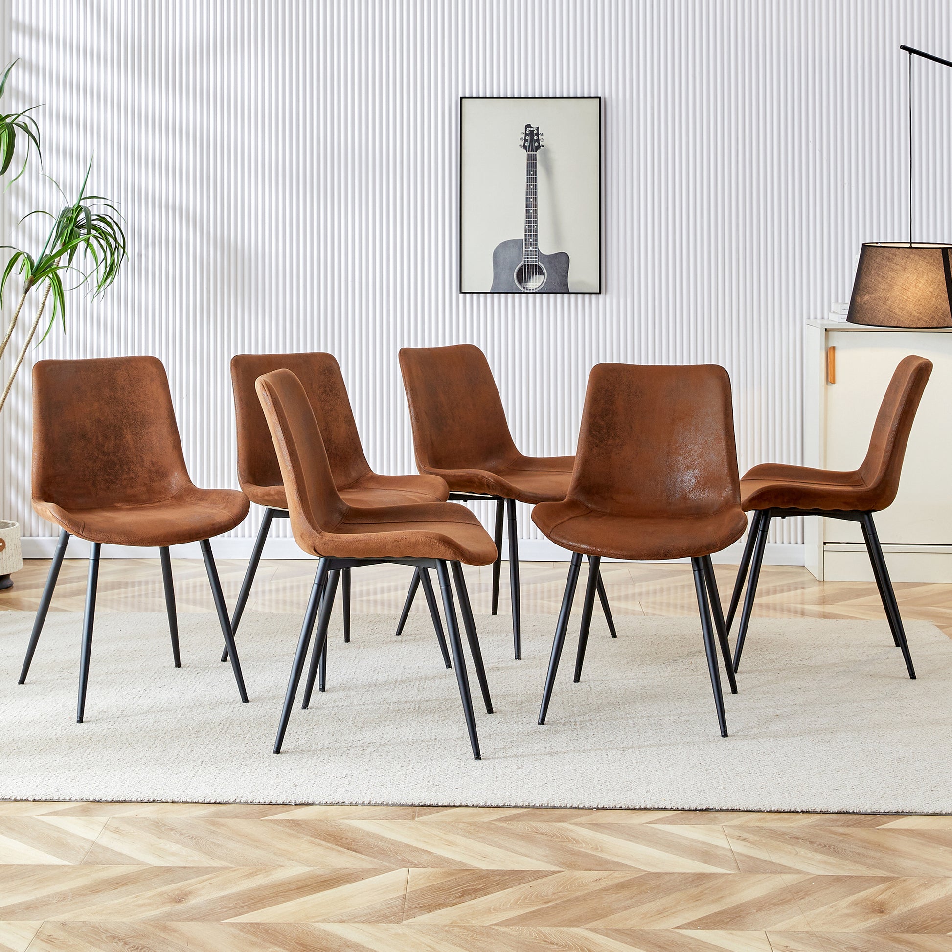 Set of  rustic brown faux leather dining chairs with black metal legs